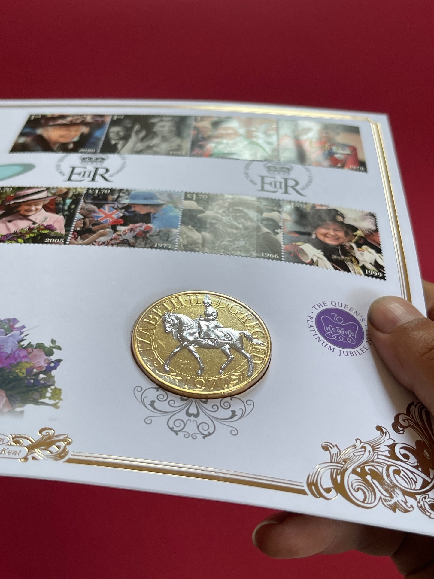 Elizabeth II,
1977 One Crown, 
Queens Platinum Jubilee Commemorative,
Uncirculated, Gold Platinum Plated coin and stamp set,
With COA
2022 (B)